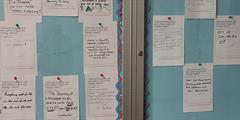 Motivational cards hang on a bulletin board at CTC Braddock.