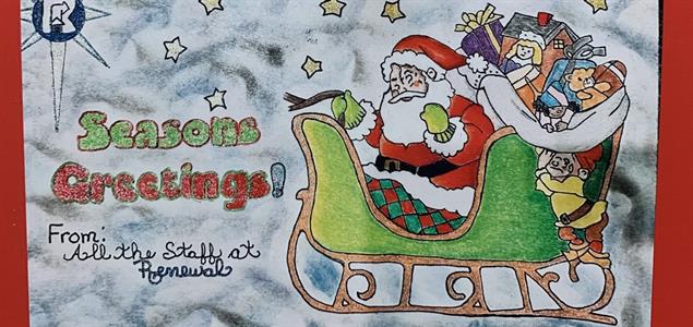 A holiday card made by a reentrant featuring Santa Claus in his sleigh with presents.