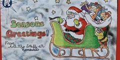 A holiday card made by a reentrant featuring Santa Claus in his sleigh with presents.