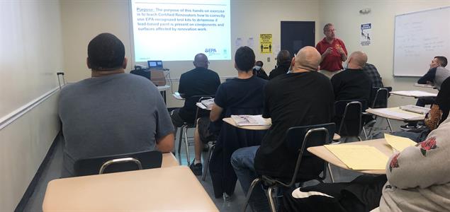 Reentrants watch DOC Assistant Chief of Safety David Crumb teach a lead paint renovator course