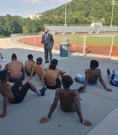 A commuted lifer speaks to a high school football team