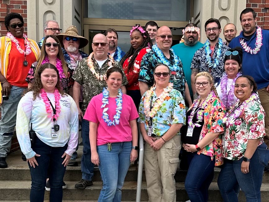 Wernersville CCC employees stand outside in their tropical attire for a special Tropical Tuesday during Institutional Parole and