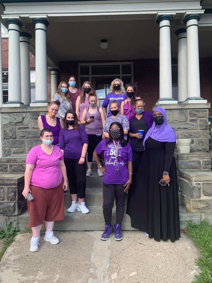 TLC staff wearing purple for domestic violence awareness