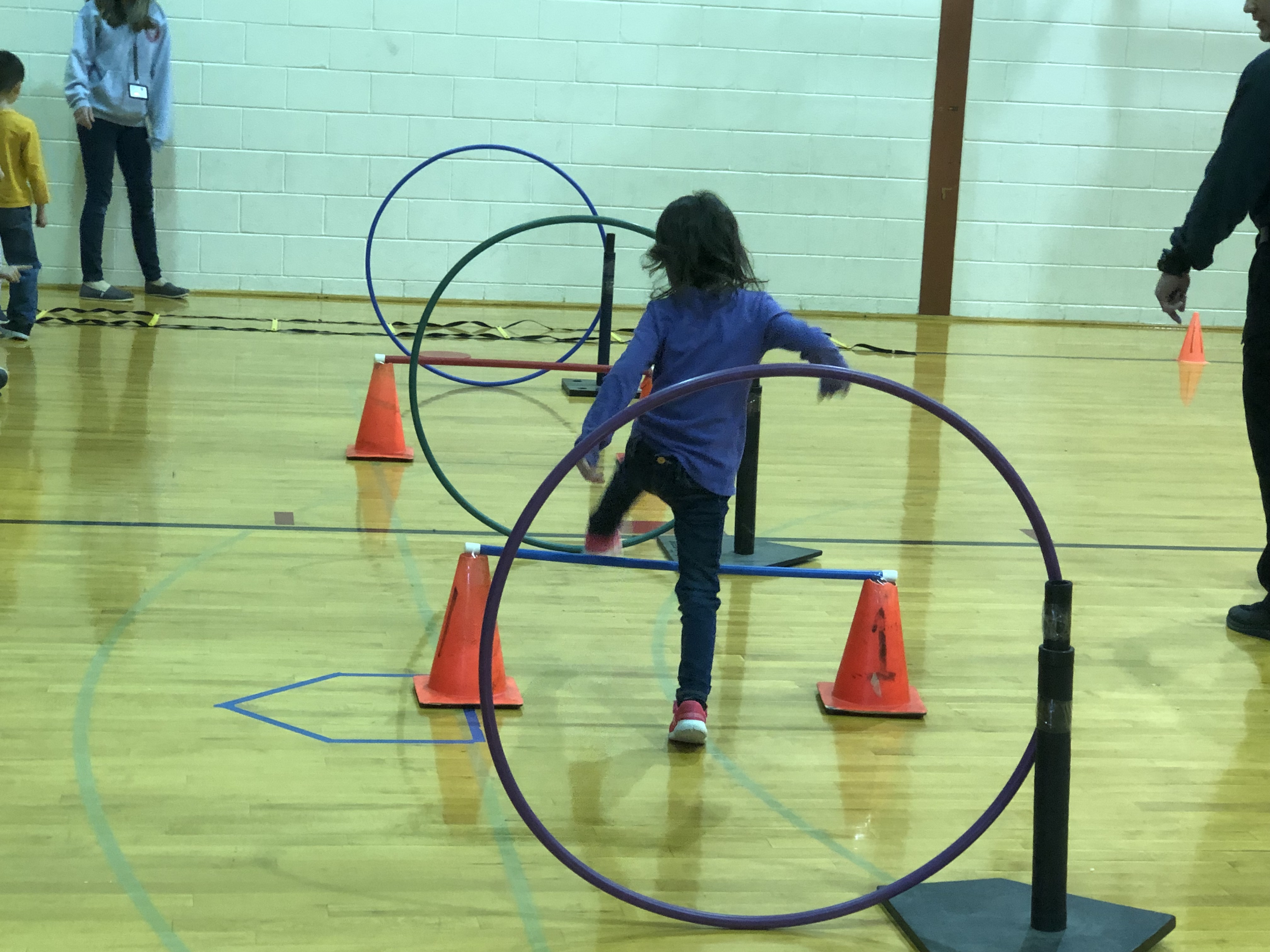A student completes an obstacle course