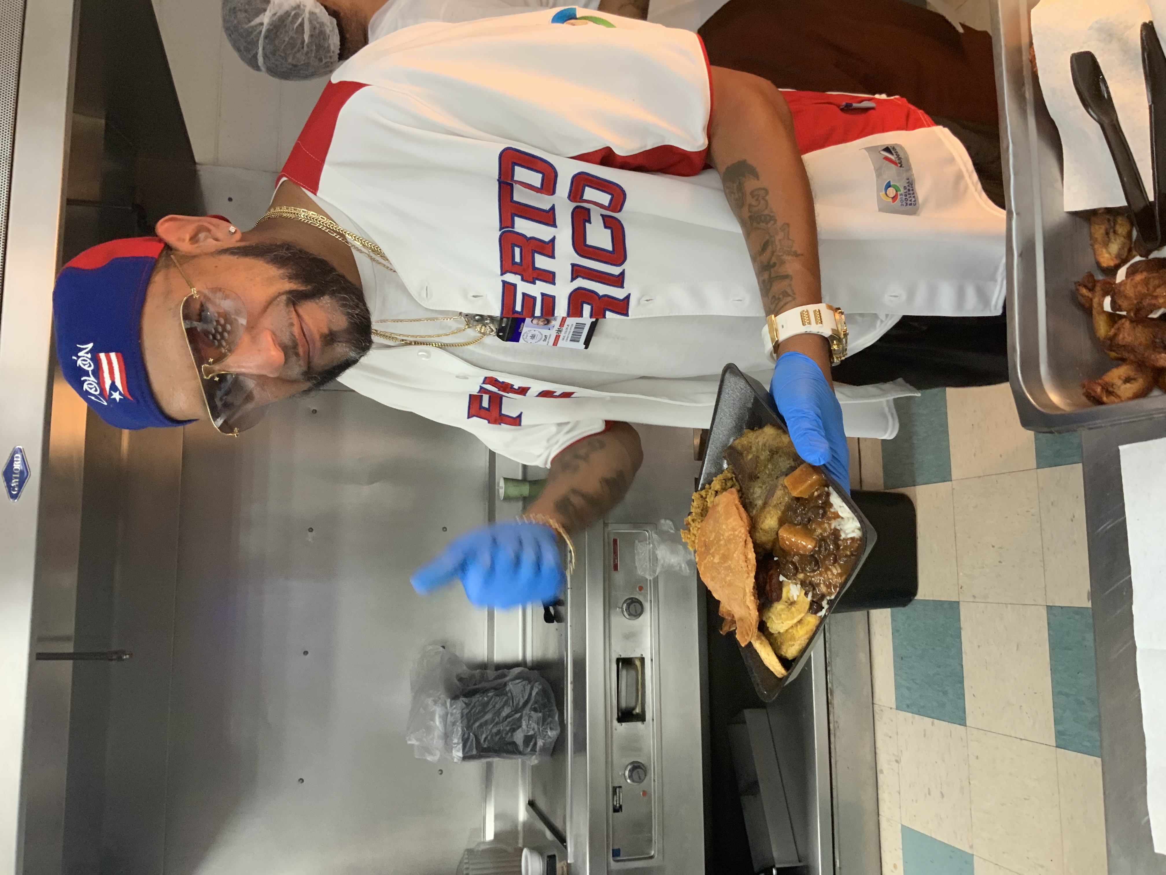 An SCI Chester employee holding a traditional Hispanic dish