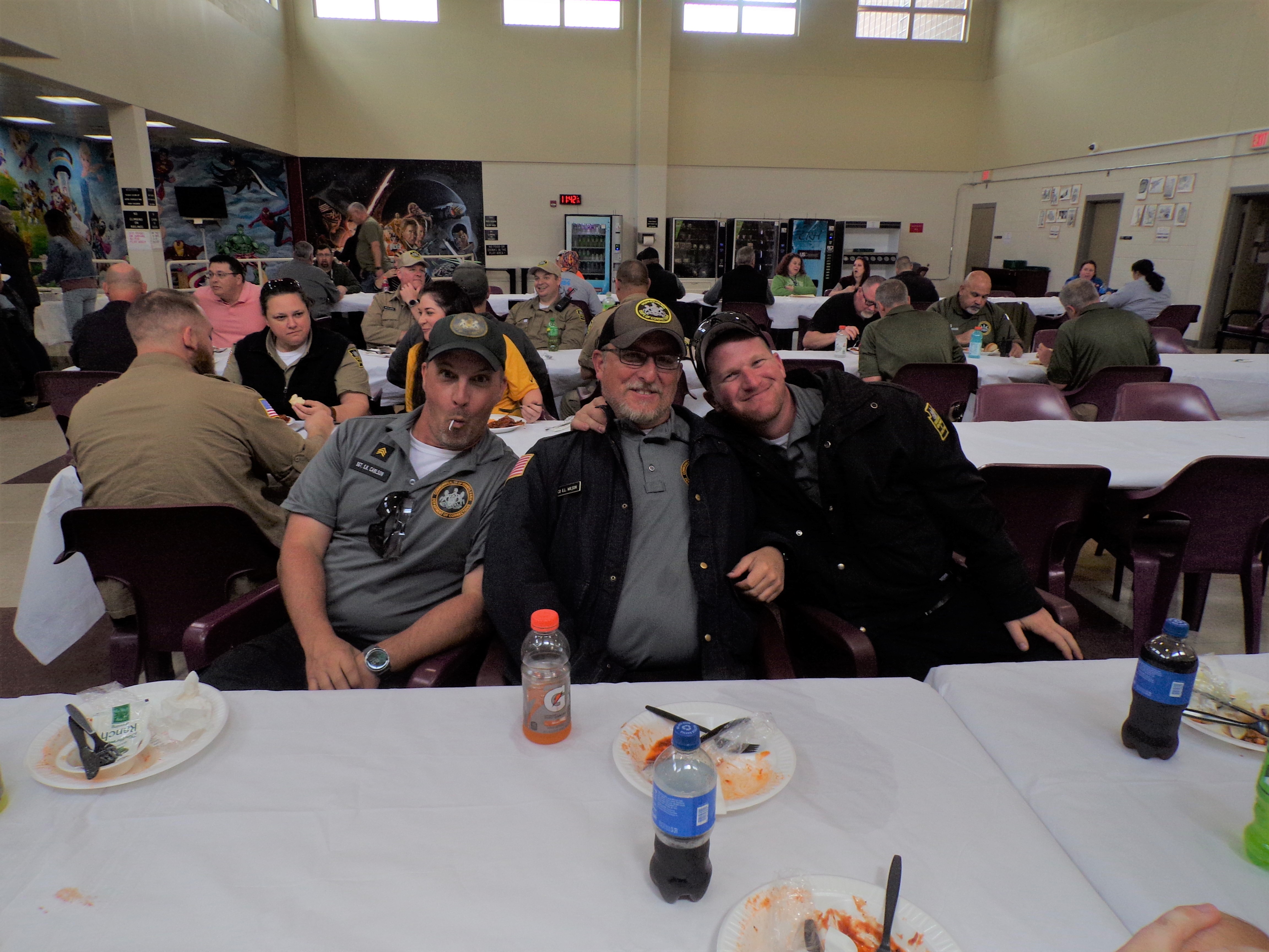 Three corrections officers at SCI Fayette pose for a photo during a special lunch