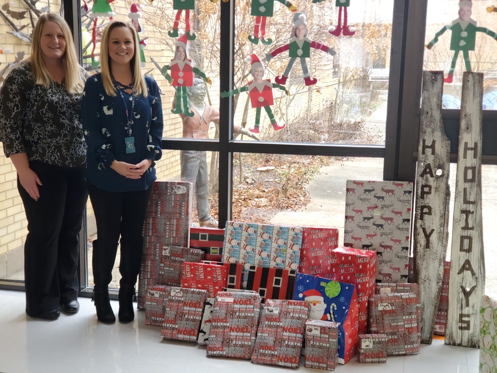 Forest employees stand with gifts donated to Angel Tree