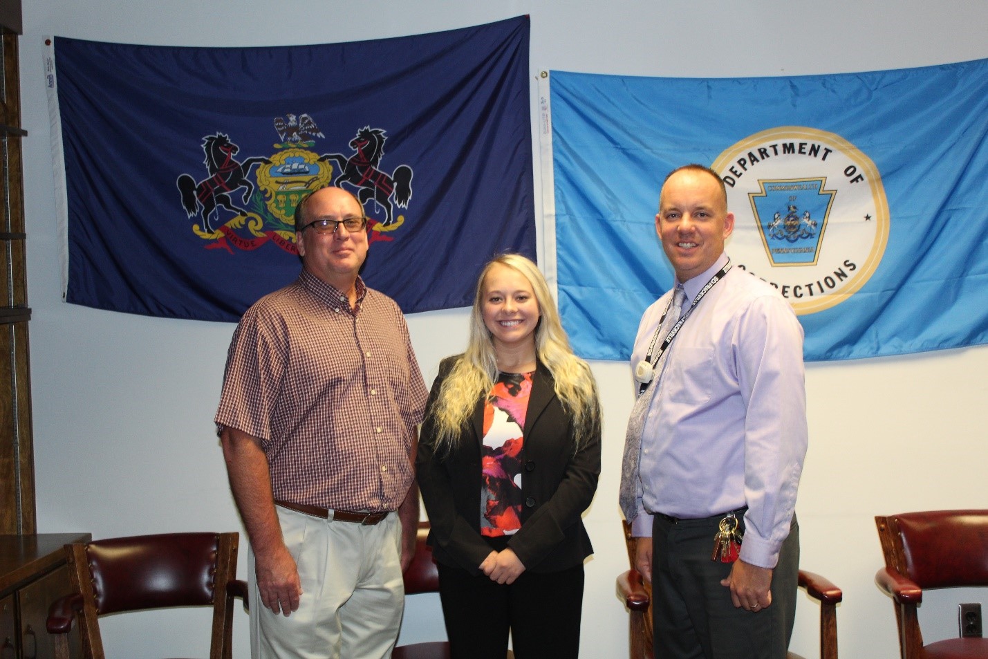 A scholarship winner with her father and SCI Frackville deputy superintendent