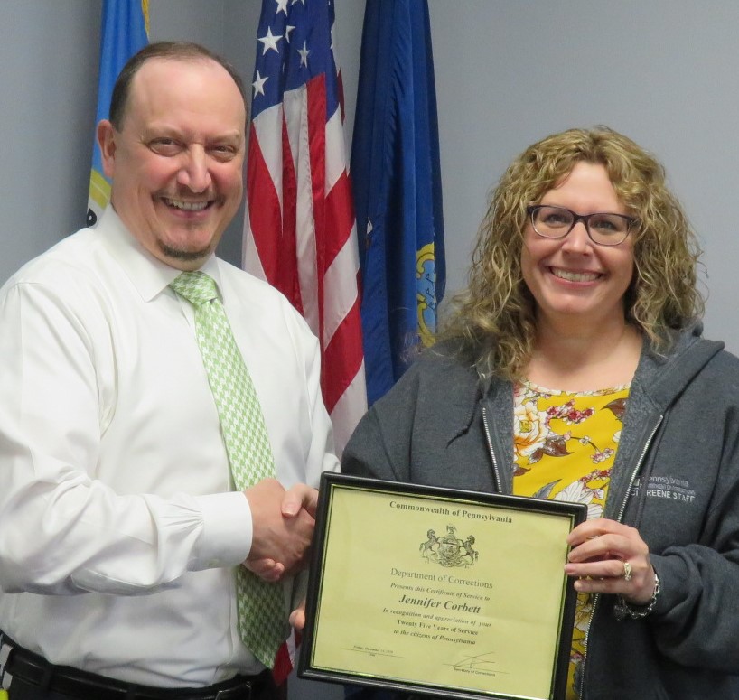 Superintendent Robert Gilmore with Jennifer Corbett holding a certificate