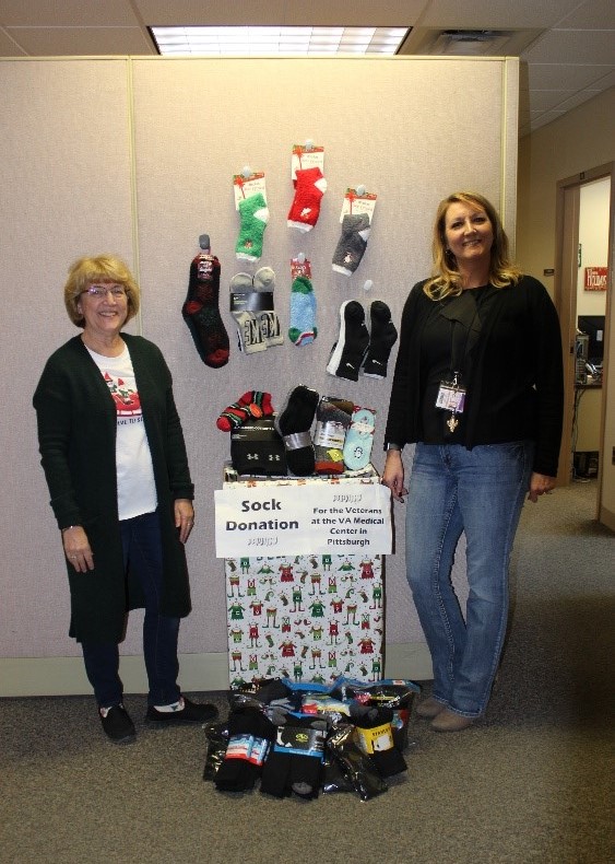 Laurel Highlands staff stand with their sock doantions