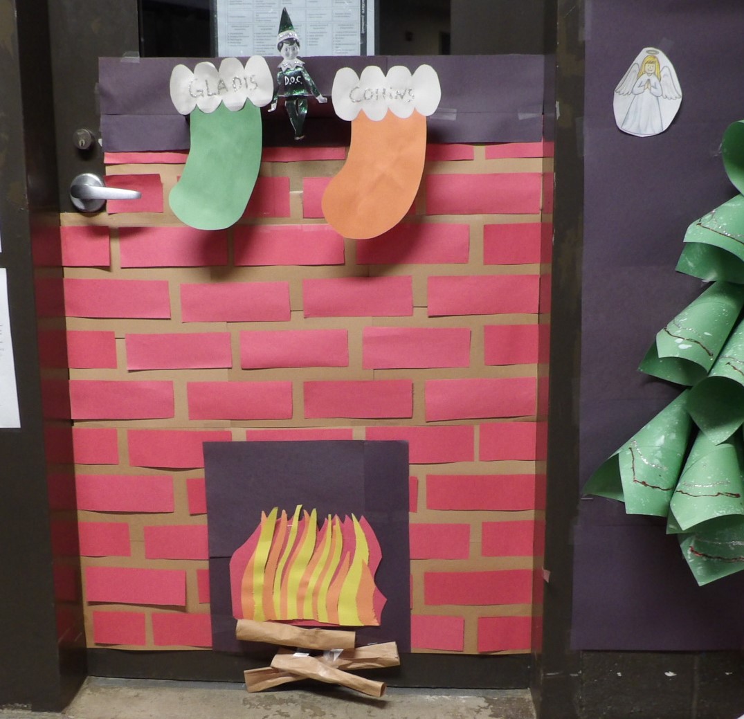 A fireplace scene made of construction paper