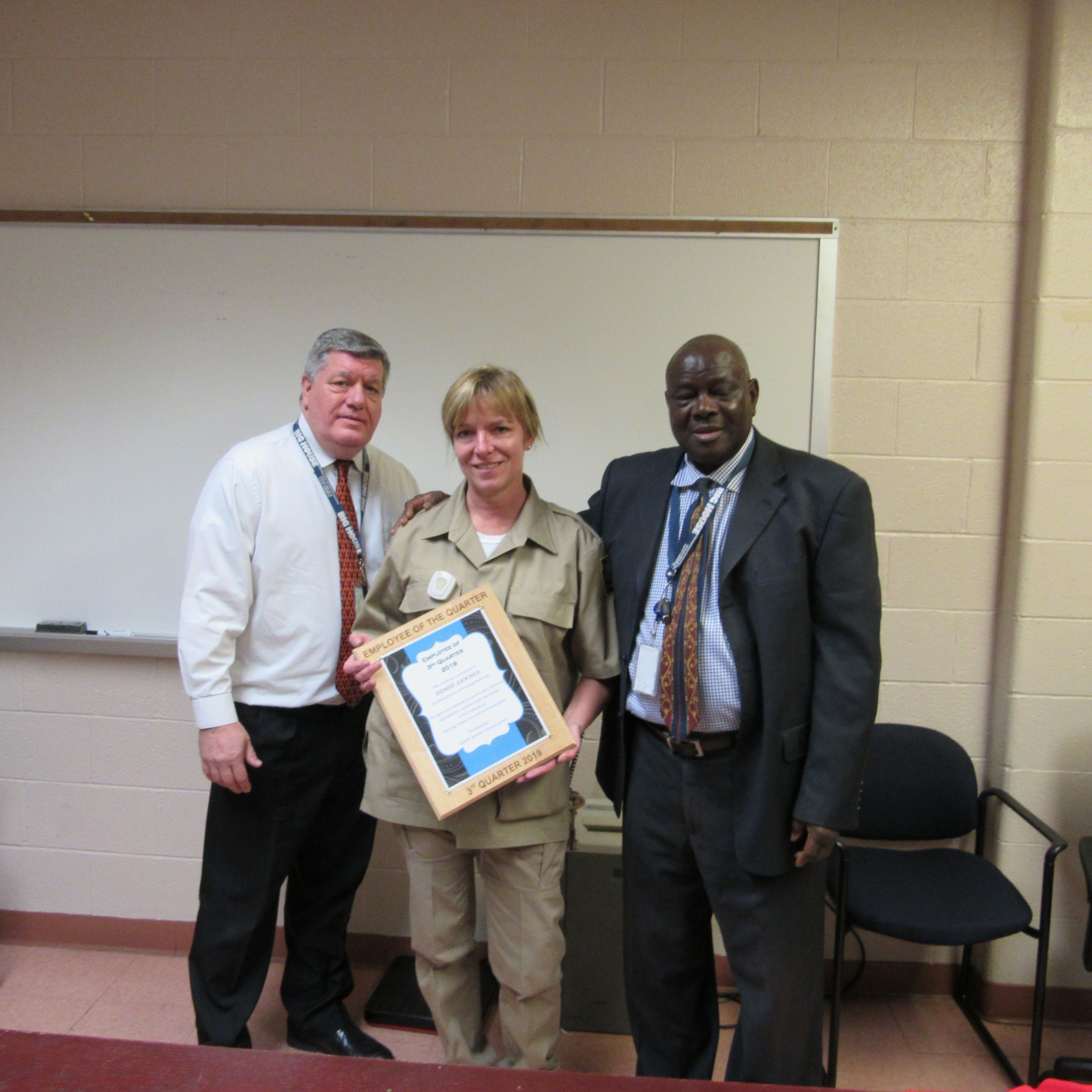 SCI Mahanoy Corrections Stock Clerk Denise Zawada gets a certificate from PCI leaders