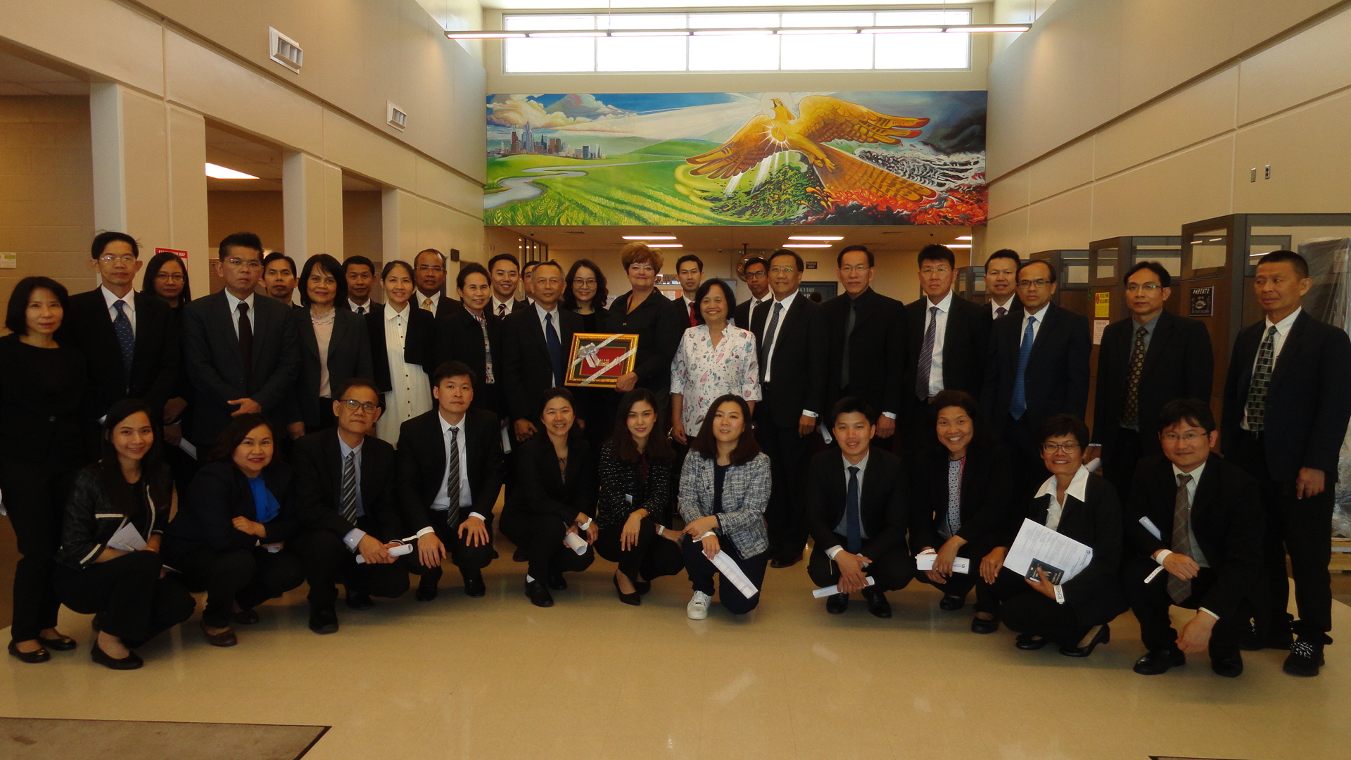 Supt. Tammi Ferguson stands with a delegation from Thailand