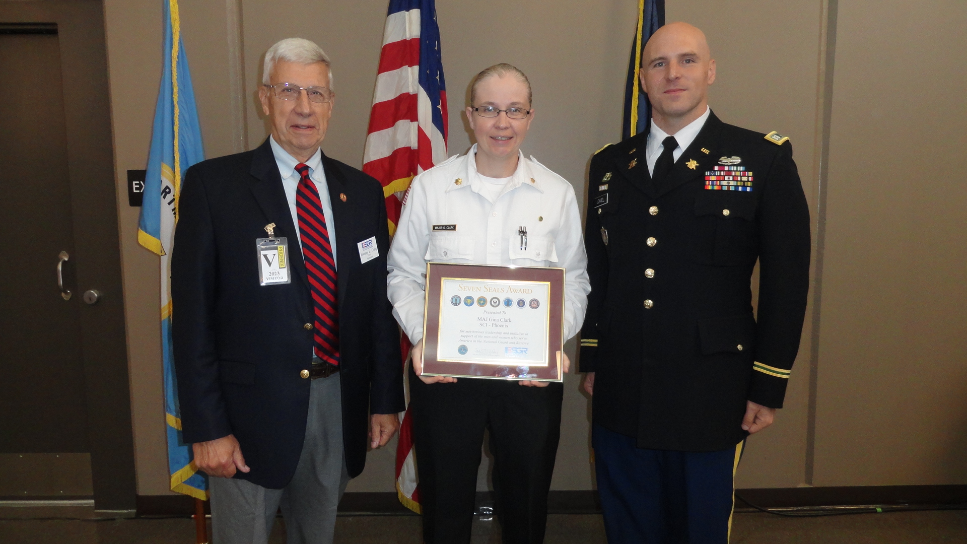 Maj. Gina Clark receives an award