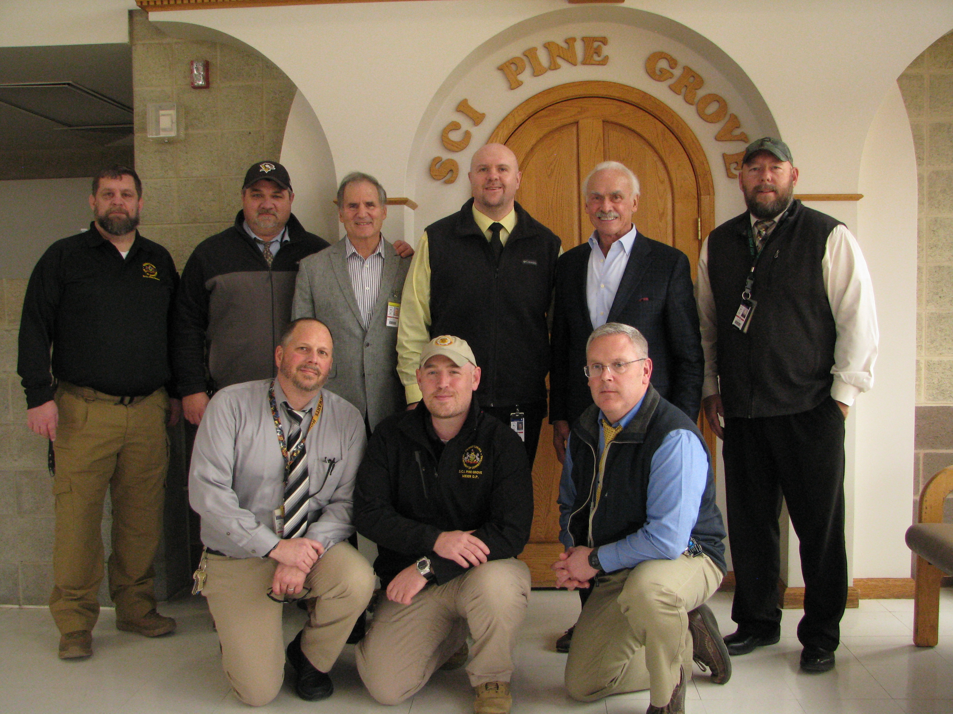 Rocky Bleier and Rocco Scalzi stand with SCI Pine Grove leadership