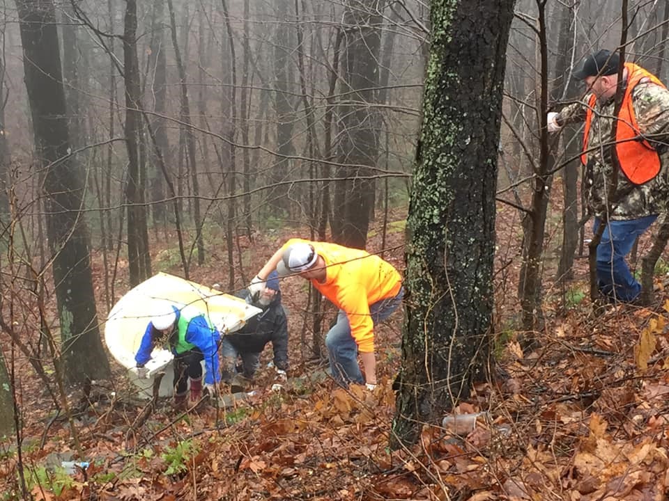 Retreat employees clean up local woods