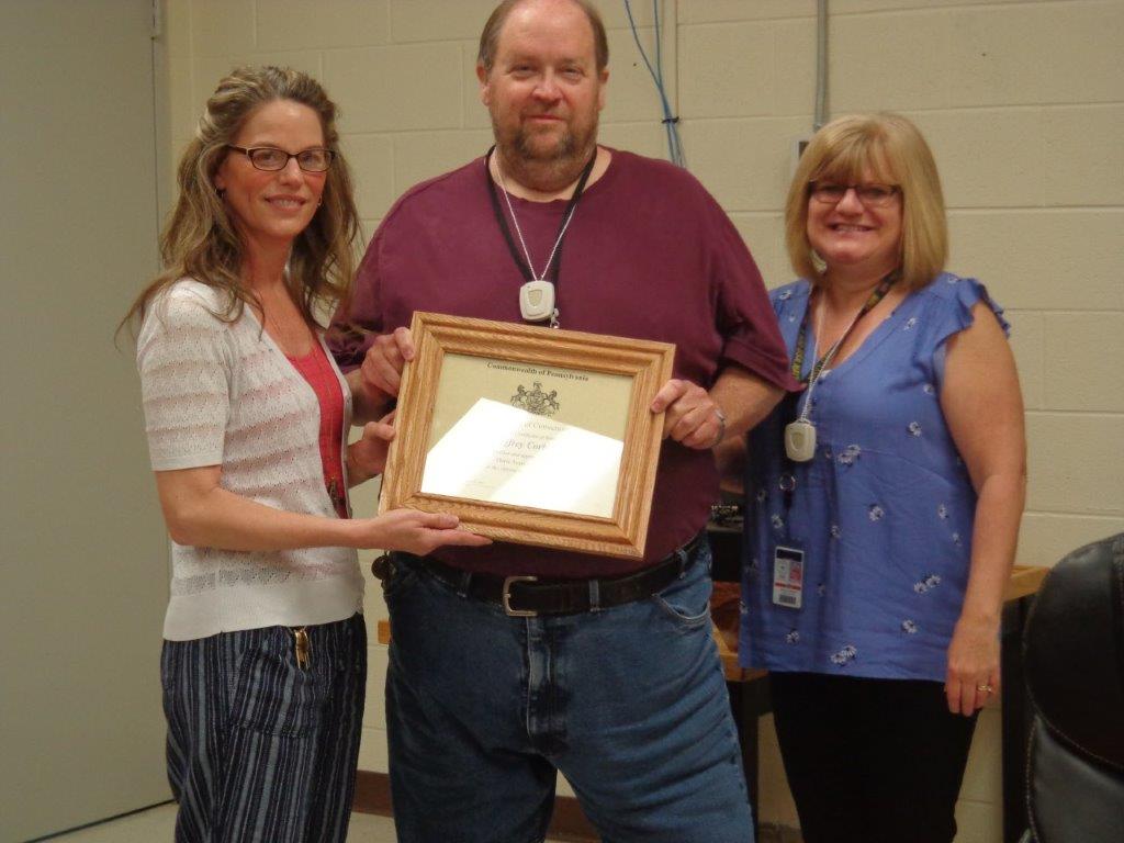 Jeff Corbin receives a certificate for 30 years of service