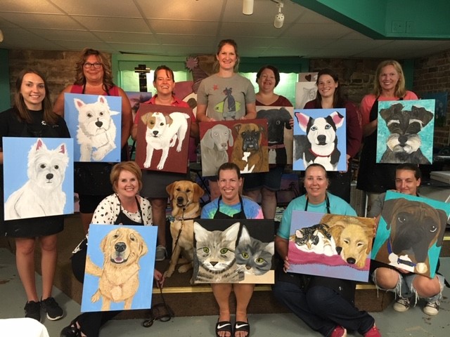 SCI Somerset staff present their paintings of their pets