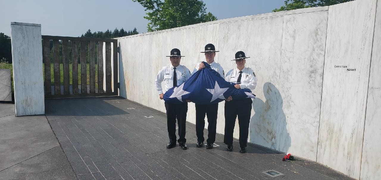 SCI Somerset's Honor Guard stands with a folded flag