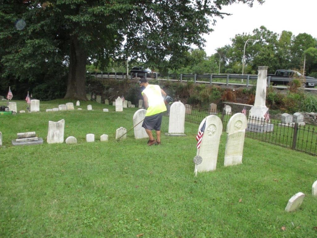 A reentrant cleans a cemetery