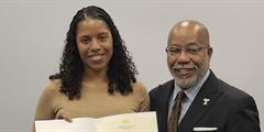 CRPA Nailah Johnson receives a certificate from a representative from Temple University