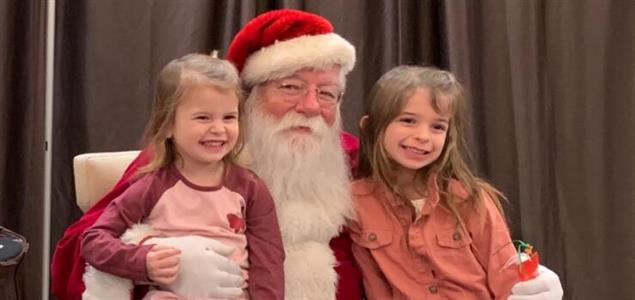 Santa Claus with two kids