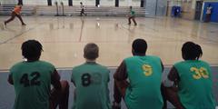 Four SCI Camp Hill inmates watch a dodgeball match