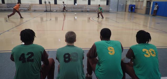 Four SCI Camp Hill inmates watch a dodgeball match