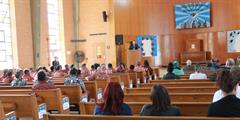 Inmates and staff watch the graduation ceremony at SCI Camp Hill in the chapel