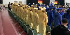 Graduates attending their graduation ceremony