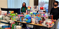 People standing with donated toys