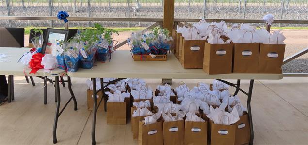 Gift bags and plants for attendees at SCI Dallas' retiree cookout