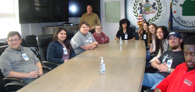 A group of students and DOC employee in SCI Fayette