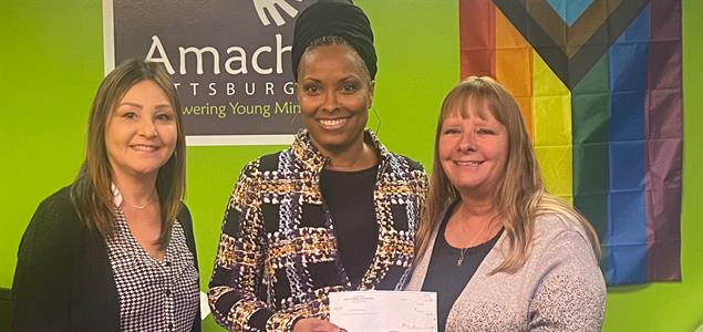 SCI Fayette Treatment Specialist Susie Sherman and Corrections Classification Program Manager Debra Hawkinberry present the check to Amachi Executive Director Anna Hollis