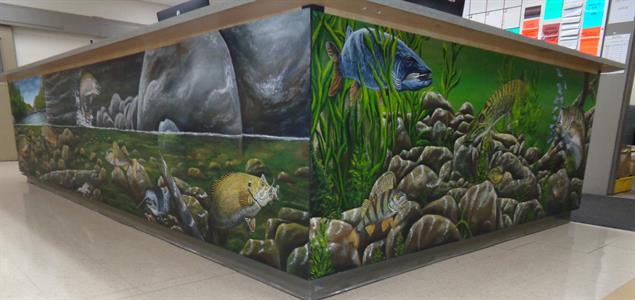 A mural showing a forest river scene
