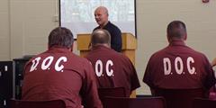 Inmates listen to a guest speaker during a Veterans Day event at SCI Fayette.