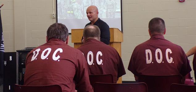 Inmates listen to a guest speaker during a Veterans Day event at SCI Fayette.