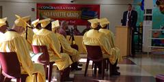 SCI Fayette graduates sit and listen to a guest speaker during their graduation ceremony.
