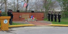 The Honor Guard stand by a memorial at SCI Greene