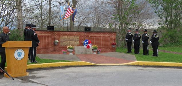 The Honor Guard stand by a memorial at SCI Greene