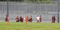 Inmates at SCI Huntingdon walk around their track as part of a walk-a-thon fundraiser
