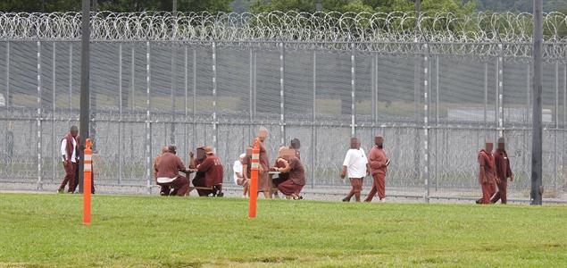 Inmates at SCI Huntingdon walk around their track as part of a walk-a-thon fundraiser
