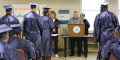 SCI Laurel Highlands inmate graduates receive their diplomas at their graduation ceremony