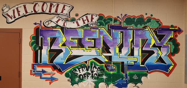 A mural that says "Welcome to the Reentry Service Office"