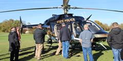 Members of SCI Mercer's Fire Emergency Response Team examine a Pennsylvania State Police helicopter.