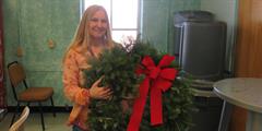 SCI Waymart Corrections Superintendent’s Assistant Christine Altemier holding a wreath