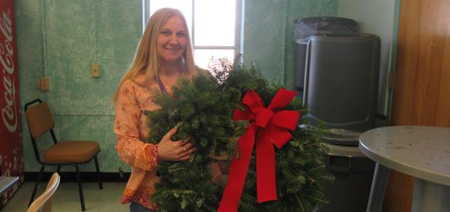 SCI Waymart Corrections Superintendent’s Assistant Christine Altemier holding a wreath