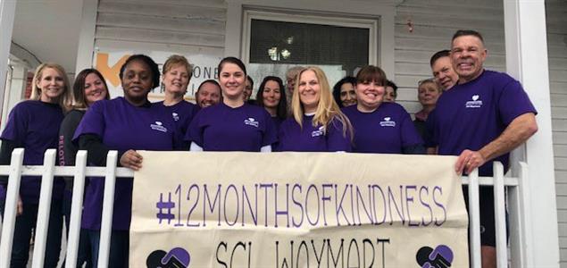 A group of SCI Waymart employees outside of Keystone Mission holding a banner that says "#12MonthsofKindness SCI Waymart"