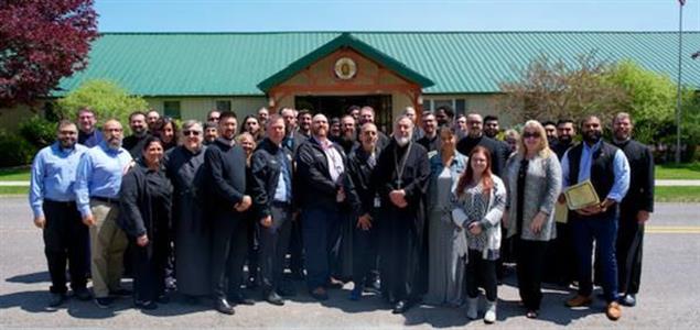 SCI Waymart leadership stands with leaders and interns from St. Tikhon's Seminary