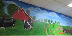 A mural at SCI Waymart featuring a modern farm.